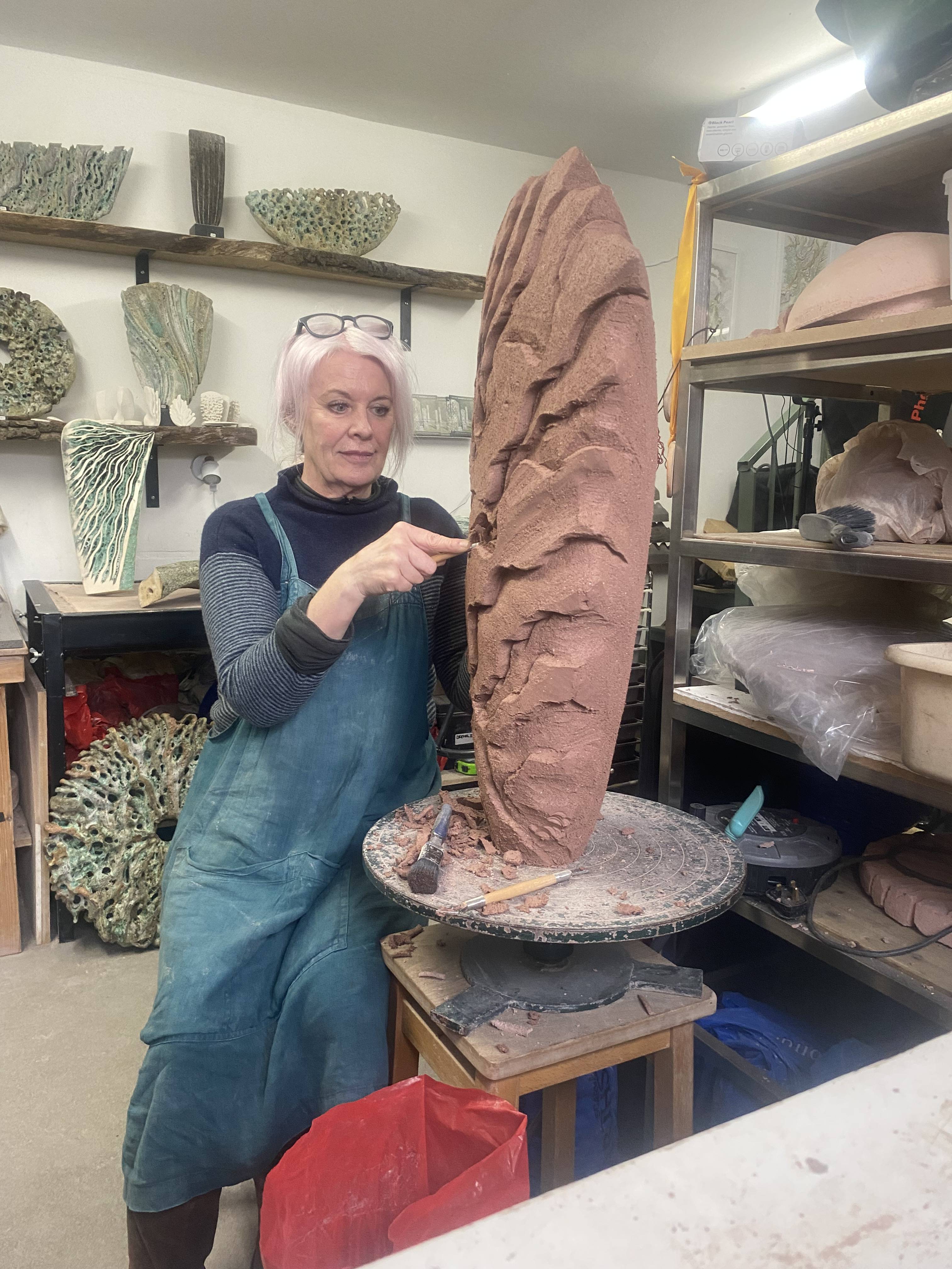a photograph of Wendy Lawrence working in her studio