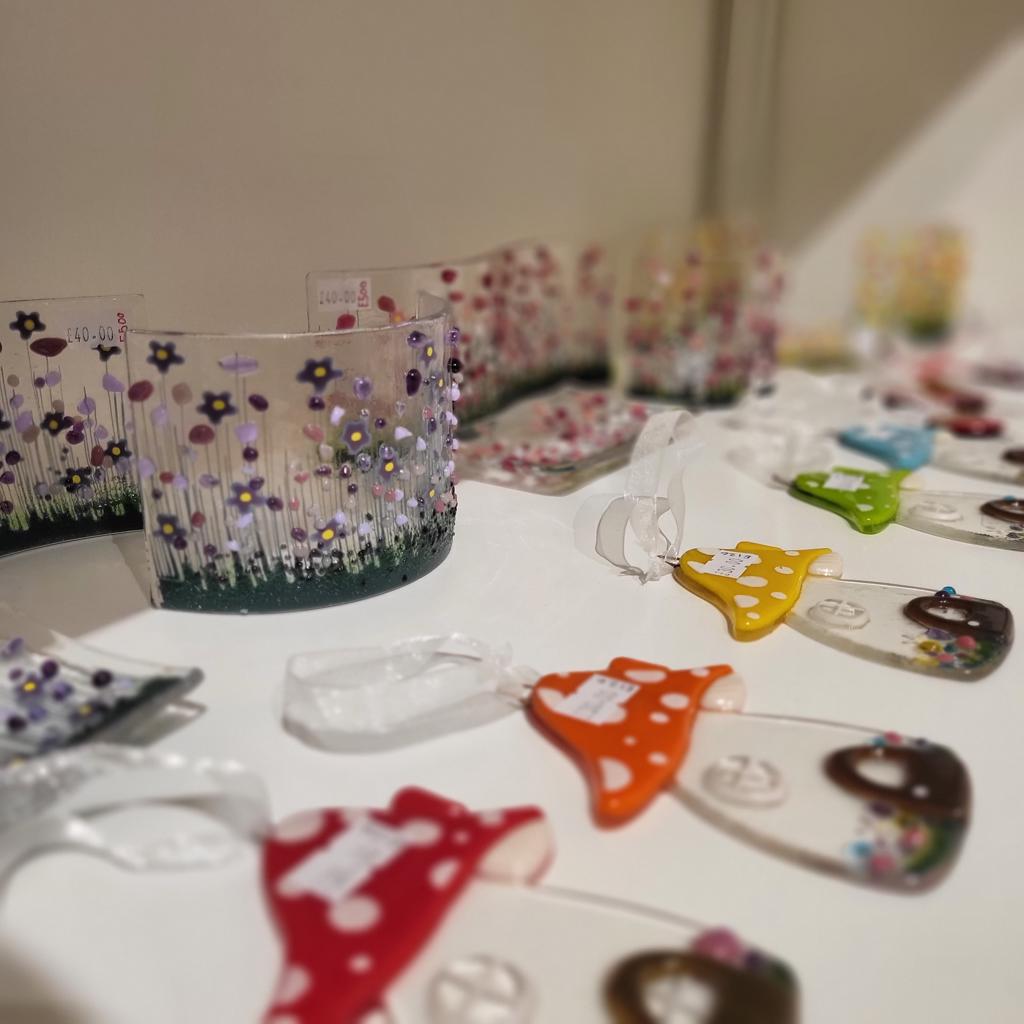 Glass suncatcher with flowers and tree decorations in the shape of mushrooms