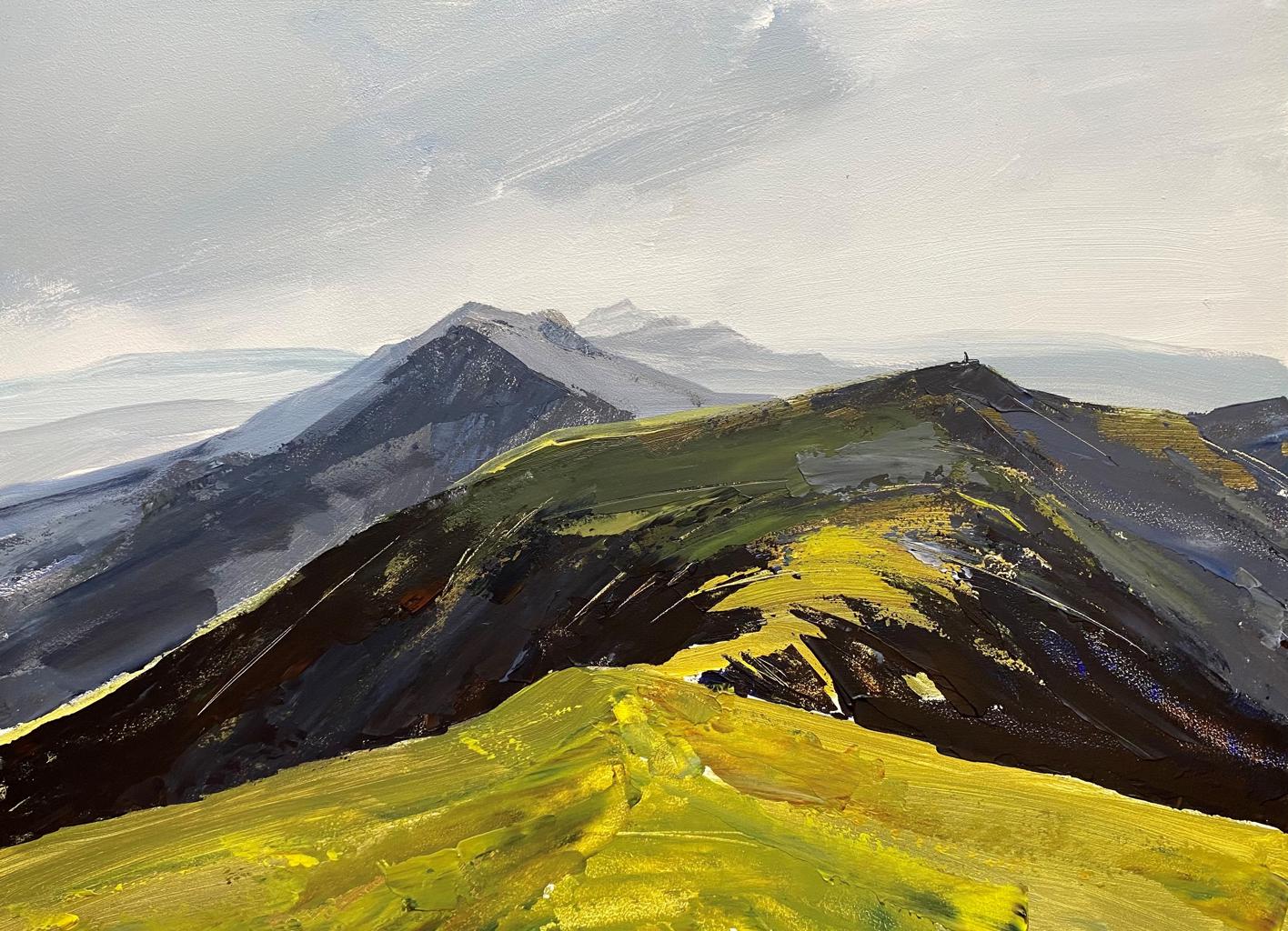 Golden mountain tops and grey skies