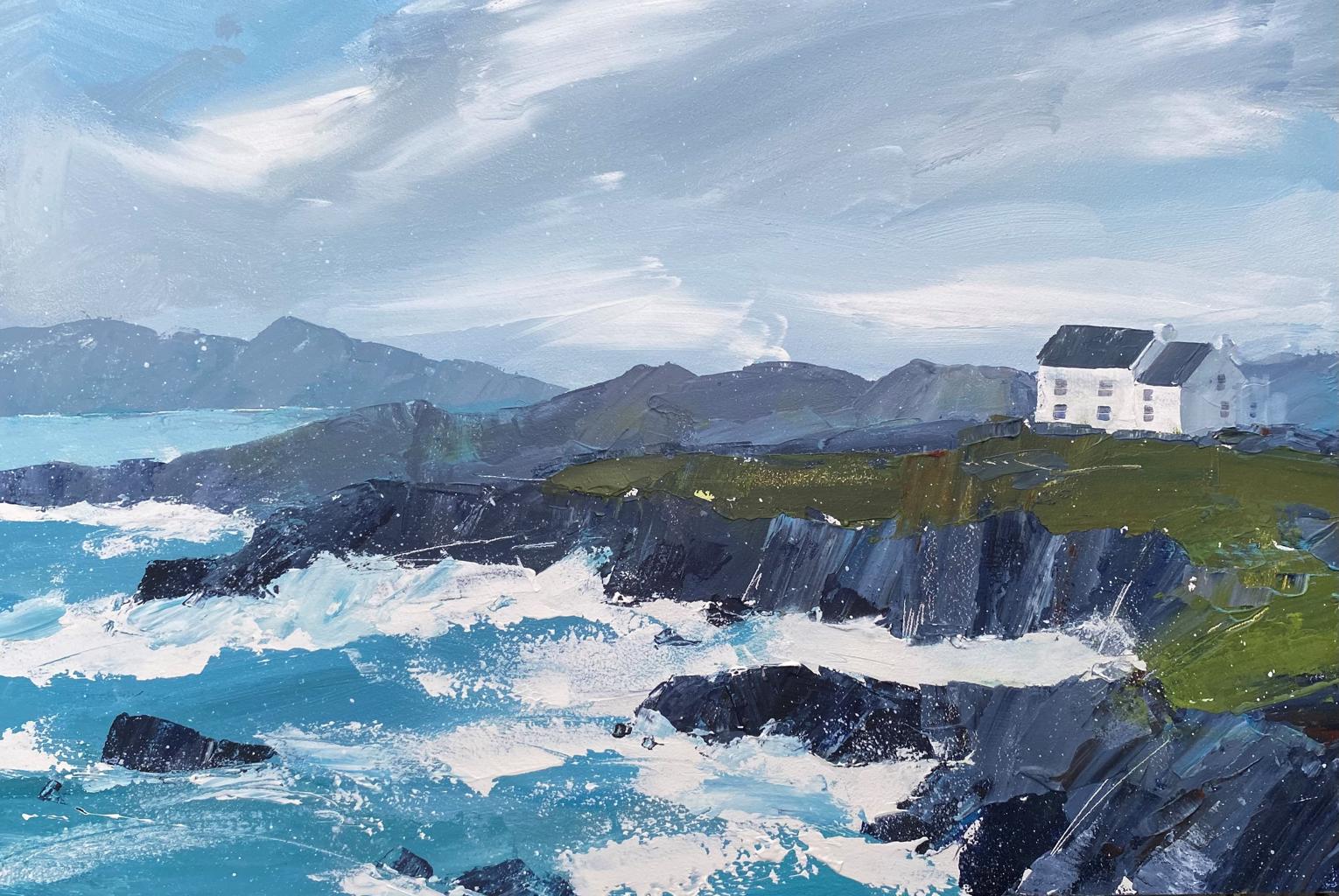 rough sea hitting edge of a cliff with a big white house sitting on top of the cliff