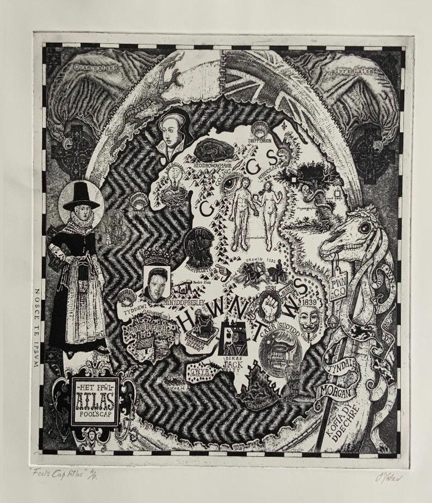 A detailed etching of an atlas of Wales with drawing of a welsh lady, skull and logos.