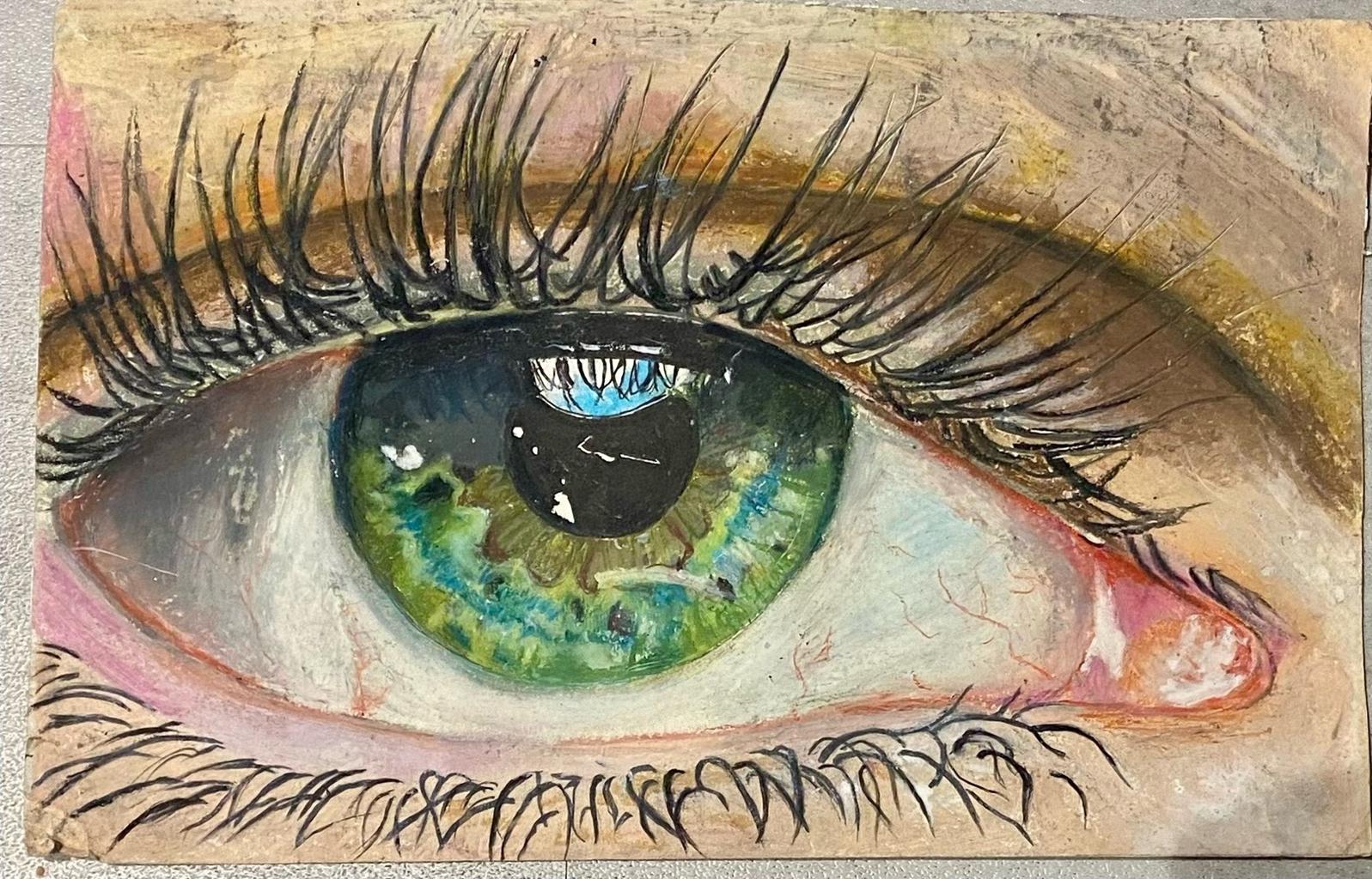 A drawing of a eye close up using oil pastel 