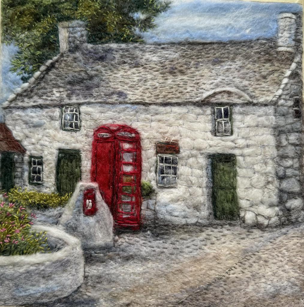 Felting of Maenaddwyn post box and cottage behind