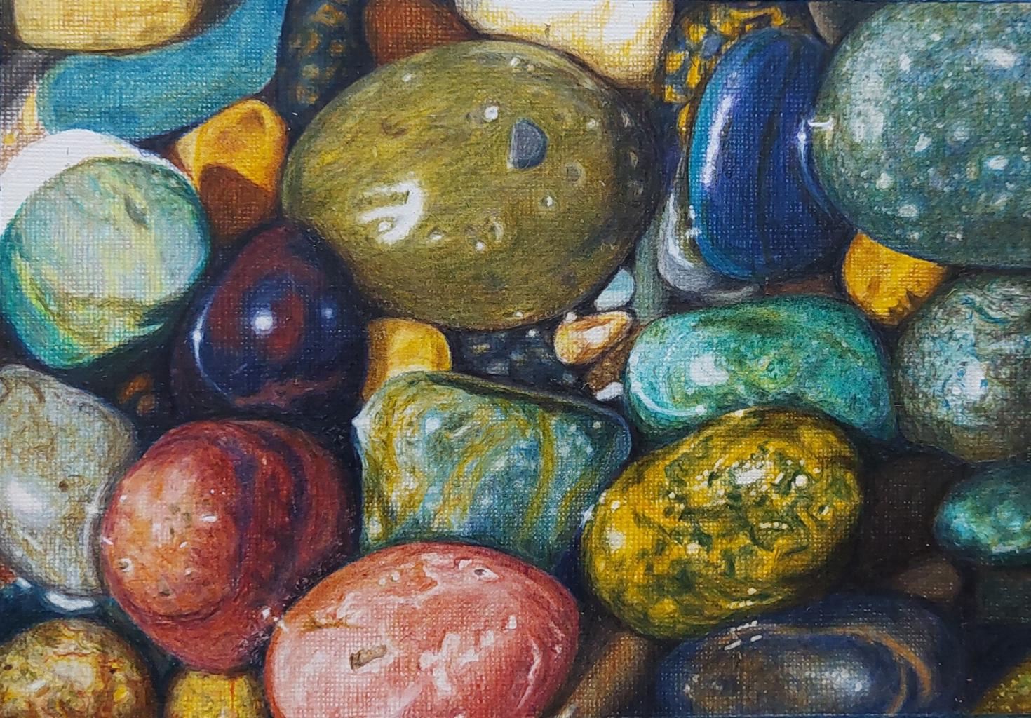 a close up drawing of colourful pebbles on a beach.