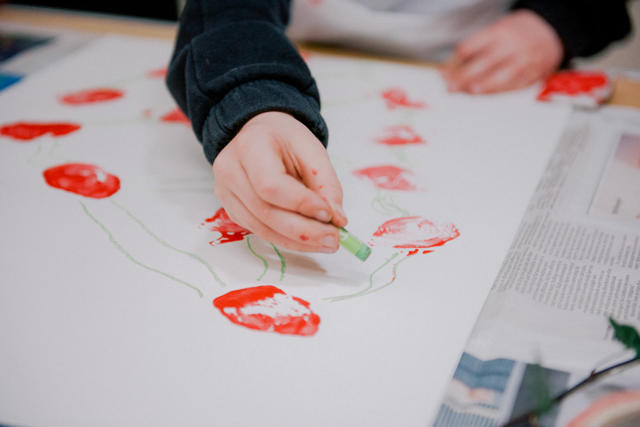 Photograph of a child drawing.