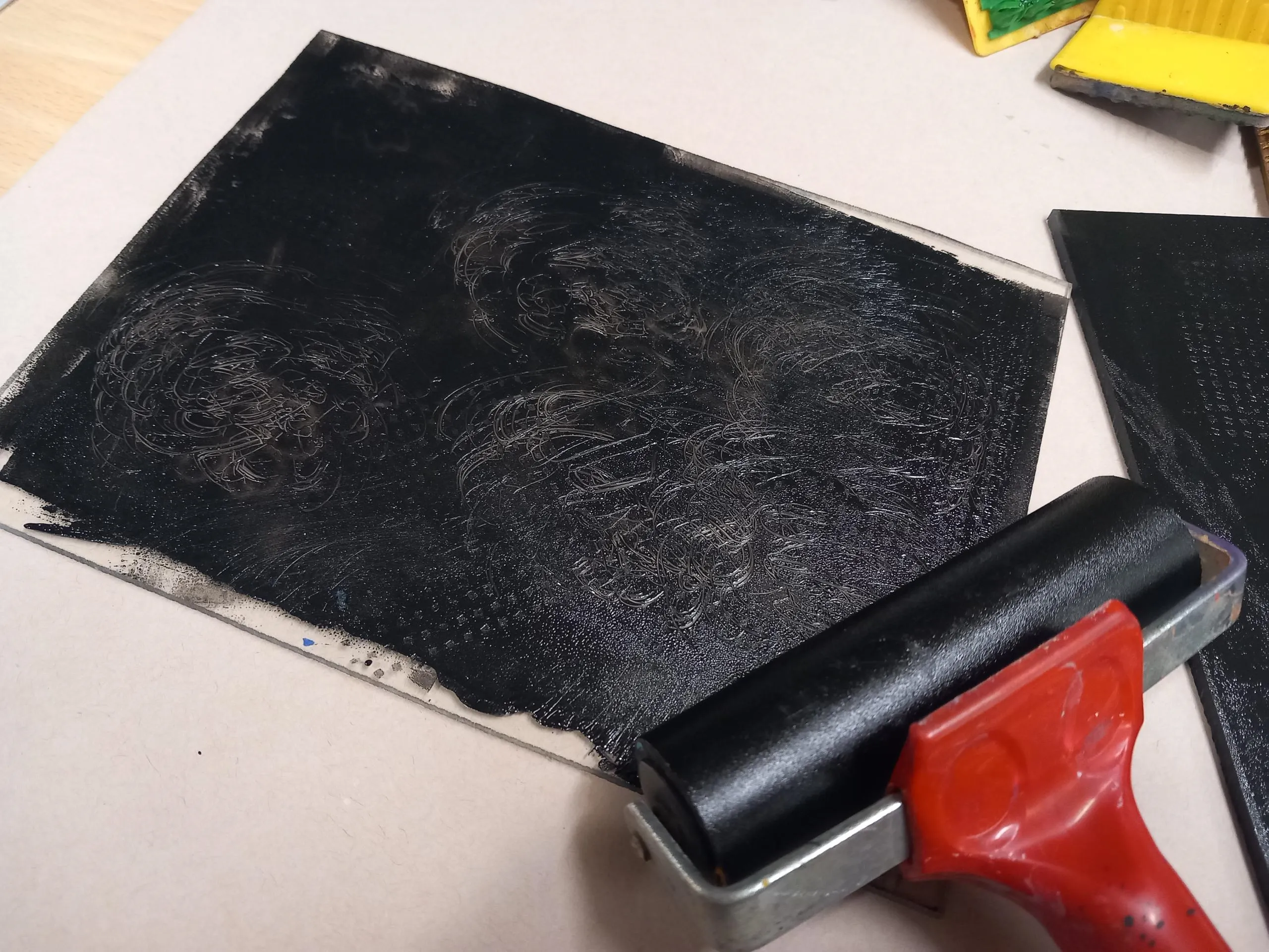 A photograph of a roller and printing ink.