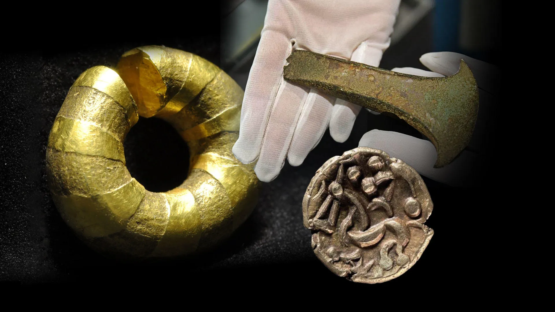 A zoomed in photograph of a gold ring, axe head and gold coin findings.