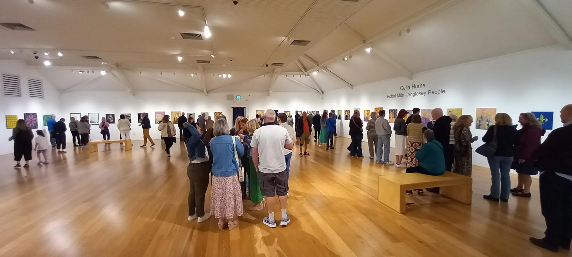 A photograph of the opening of Celia's exhibition.