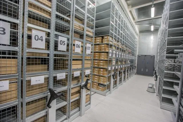A wider view of racks of archival storage.