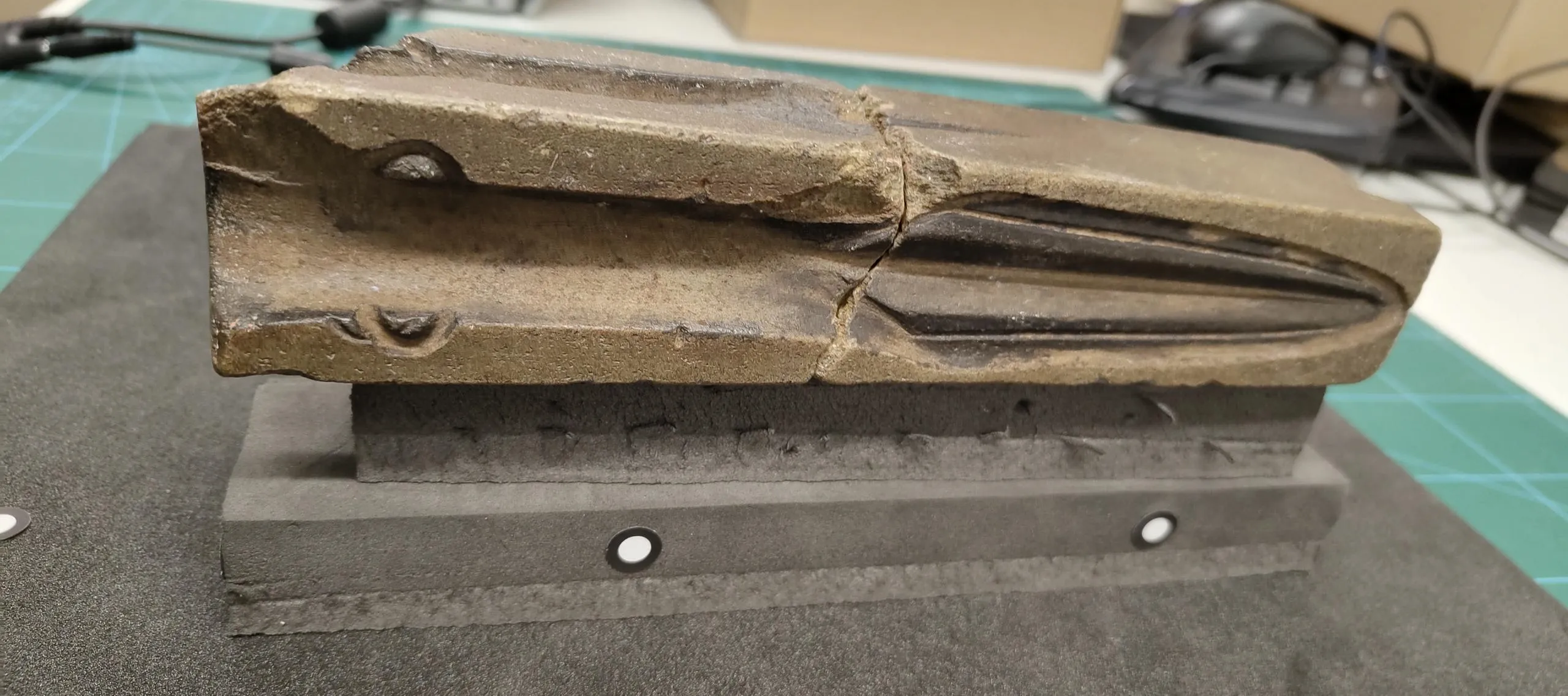 Photograph of a moulding for a spear head.