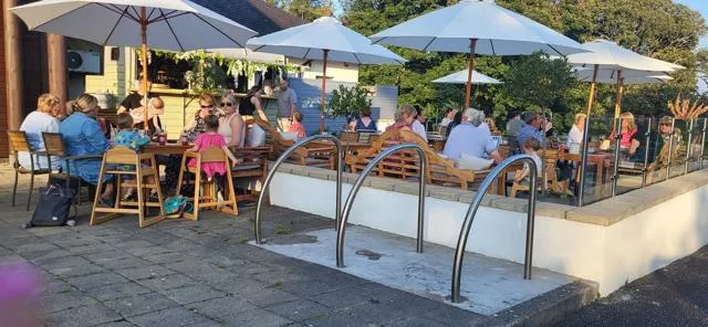 People enjoying a Cocktail and Tapas evening at Caffi Bach y Bocs