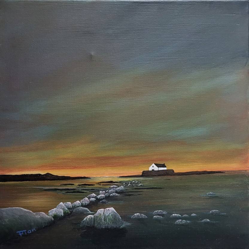 a painting of Eglwys Cwyfan with stones leading the way in to the sea